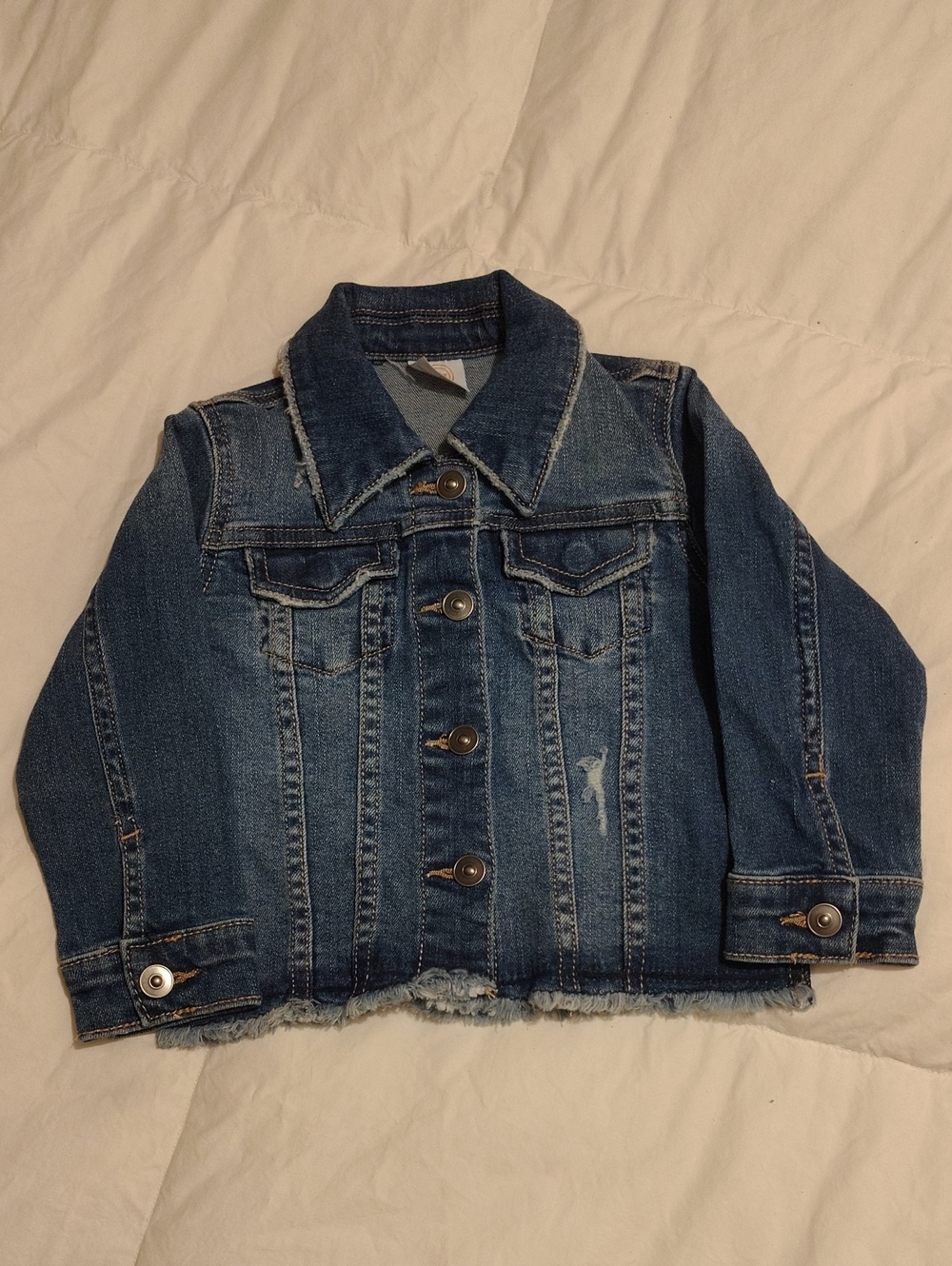 Classic Blue Denim Jacket with Distressed Hem